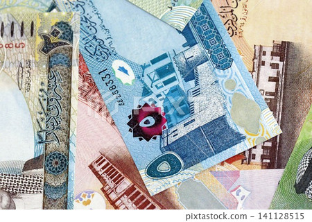 Bahraini dinar currency money bills. The current banknotes lies on table in big amount Bahraini dinar currency money bills. The current banknotes lies on table in big amount 141128515