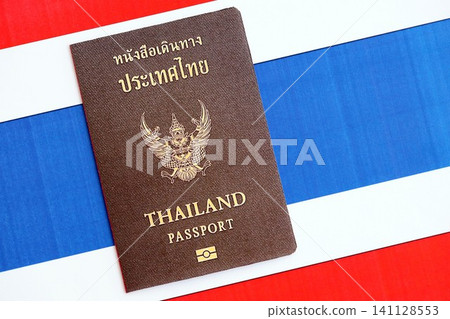 Thai passport on flag. The concept of citizenship Thai passport on flag. The concept of citizenship 141128553