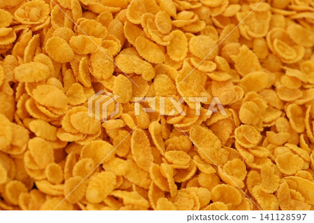 Corn flakes background and texture. Top view cornflake cereal box for breakfast Corn flakes background and texture. Top view cornflake cereal box for breakfast 141128597