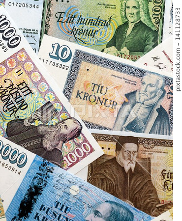 Icelandic krona money bills pile on table. Iceland banknotes of ISK currency close up Icelandic krona money bills pile on table. Iceland banknotes of ISK currency close up 141128733