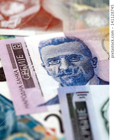 Serbian dinar money bills pile on table. Serbia banknotes of RSD currency. Concept of business Serbian dinar money bills pile on table. Serbia banknotes of RSD currency. Concept of business 141128745