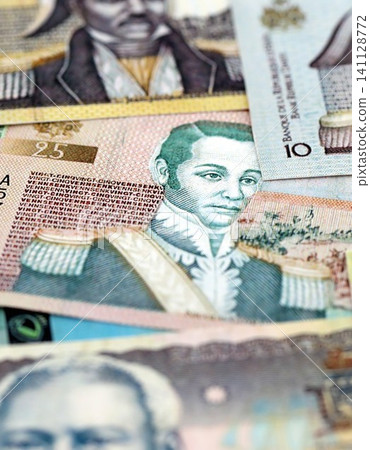 Haitian gourde money bills pile on table. Haiti banknotes of HTG currency. Concept of business Haitian gourde money bills pile on table. Haiti banknotes of HTG currency. Concept of business 141128772