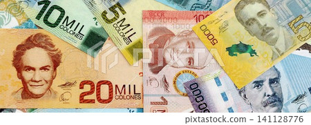Costa Rican colon money bills pile on table. Costa Rica banknotes of CRC currency close up 141128776