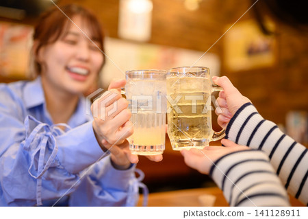 A woman toast with beer A woman toast with beer 141128911