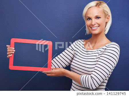 Woman, studio and portrait or holding frame, presentation and mockup for advertisement, customer and checklist. Option, choice or announcement idea and notification, information with female person Woman, studio and portrait or holding frame, presentation and mockup for advertisement, customer and checklist. Option, choice or announcement idea and notification, information with female person 141129745