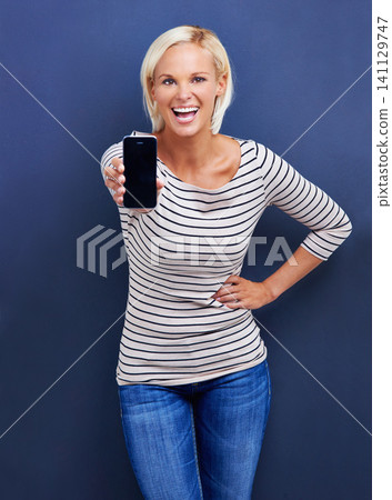 Woman, phone and portrait for technology, marketing and online for advertising, present or info for screen. Young person, smile and happy with presentation on tech for internet, showing and streaming Woman, phone and portrait for technology, marketing and online for advertising, present or info for screen. Young person, smile and happy with presentation on tech for internet, showing and streaming 141129747