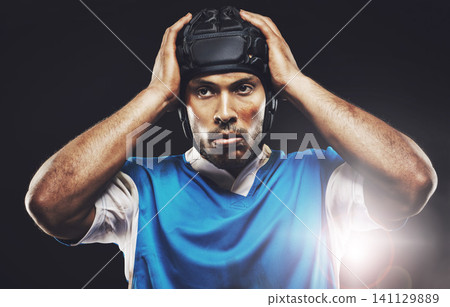 Black background, serious and man ready for rugby match or training, tough and focused for fitness. Male player, determination and professional for football game, athlete and strong for workout Black background, serious and man ready for rugby match or training, tough and focused for fitness. Male player, determination and professional for football game, athlete and strong for workout 141129889