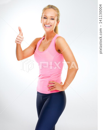 Portrait, personal trainer and woman with thumbs up for exercise, studio and support or vote for fitness. Adult, female person and girl with smile for workout, happiness and thank you for training Portrait, personal trainer and woman with thumbs up for exercise, studio and support or vote for fitness. Adult, female person and girl with smile for workout, happiness and thank you for training 141130004