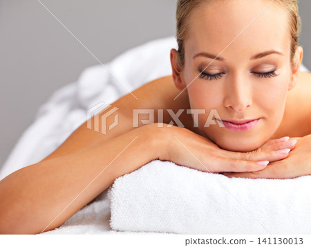 Woman, massage and spa for zen and treatment, destress and wellness for acupressure at luxury resort. Serene, peace and calm with eyes closed for stress relief, self care service and holistic healing Woman, massage and spa for zen and treatment, destress and wellness for acupressure at luxury resort. Serene, peace and calm with eyes closed for stress relief, self care service and holistic healing 141130013