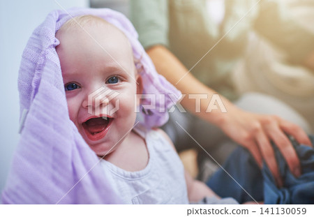 Laundry, washing and portrait of baby with clothes in home for playing, housekeeping and housework. Family, laughing and parent with happy, excited and playful newborn infant with clothing on floor Laundry, washing and portrait of baby with clothes in home for playing, housekeeping and housework. Family, laughing and parent with happy, excited and playful newborn infant with clothing on floor 141130059