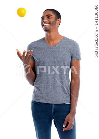 Man, lemon and fruit for healthy and fresh for diet, immune system and vitamin. African person or dietician and smile with snack and throw in air for play, detox and citrus on white background Man, lemon and fruit for healthy and fresh for diet, immune system and vitamin. African person or dietician and smile with snack and throw in air for play, detox and citrus on white background 141130060
