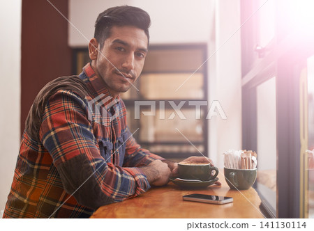Man, portrait and coffee by window for morning, breakfast or drink at indoor cafe or restaurant. Male person or freelancer with smile for latte, customer service or cappuccino at cafeteria or shop Man, portrait and coffee by window for morning, breakfast or drink at indoor cafe or restaurant. Male person or freelancer with smile for latte, customer service or cappuccino at cafeteria or shop 141130114