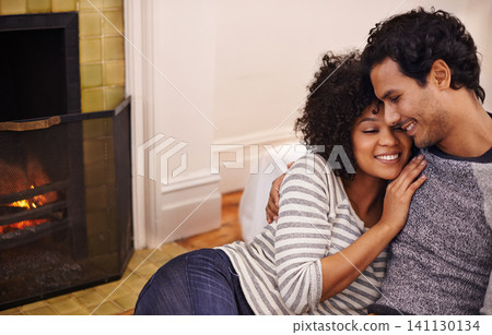 Couple, fireplace and smile in embrace, home and peace or calm and proud of marriage or commitment. Happy people, holding and hugging on floor in lounge on weekend, support and trust in relationship Couple, fireplace and smile in embrace, home and peace or calm and proud of marriage or commitment. Happy people, holding and hugging on floor in lounge on weekend, support and trust in relationship 141130134