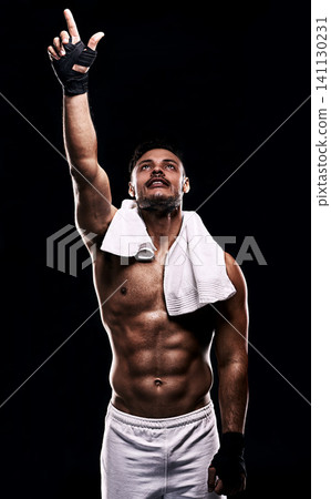Man, boxer and hand in studio for faith, fitness and pointing up for training on black background. Person, athlete and strong muscles for workout or exercise, religion and battle or competition Man, boxer and hand in studio for faith, fitness and pointing up for training on black background. Person, athlete and strong muscles for workout or exercise, religion and battle or competition 141130231