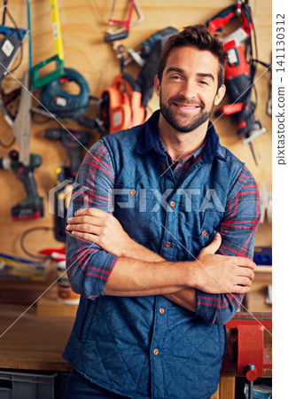Man, tools and portrait in workshop or garage for diy, repair and maintenance for job, skill or tradesman. Artisan, handyman or carpenter with smile and confident with equipment for repairs indoor Man, tools and portrait in workshop or garage for diy, repair and maintenance for job, skill or tradesman. Artisan, handyman or carpenter with smile and confident with equipment for repairs indoor 141130312