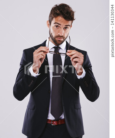 Portrait, studio and businessman with suit, glasses for vision on lawyer or question expression and necktie. Corporate man person, professional with cool confidence, mockup and legal consultant Portrait, studio and businessman with suit, glasses for vision on lawyer or question expression and necktie. Corporate man person, professional with cool confidence, mockup and legal consultant 141130344