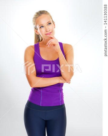 Woman, thinking or fitness in studio with smile for healthy training ideas, wellness or reflection on exercise. Athlete, person or thoughtful with sportswear for workout or happy on white background Woman, thinking or fitness in studio with smile for healthy training ideas, wellness or reflection on exercise. Athlete, person or thoughtful with sportswear for workout or happy on white background 141130388