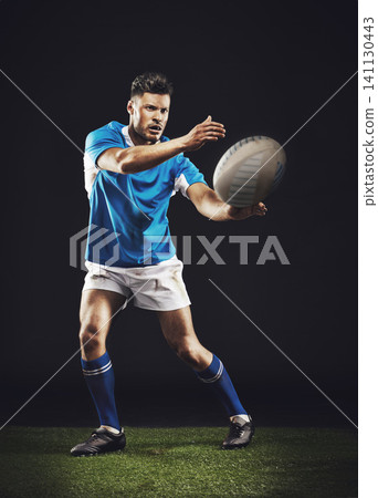Night, man and pass ball for rugby sports goal or training for skill for football game or match, professional and athlete. Male person or player, action and energy for competition and fitness workout Night, man and pass ball for rugby sports goal or training for skill for football game or match, professional and athlete. Male person or player, action and energy for competition and fitness workout 141130443
