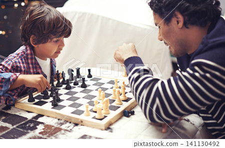 Father, child and chess board game for competition challenge for planning strategy with pawn, knight or queen. Man, son and thinking choice for moving piece for winning play, holiday or connection 141130492