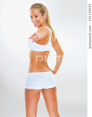Fitness, exercise and portrait of woman pointing for training, health and sports isolated on white background. Female person, body and wellness with gym clothes for workout, aerobics and diet Fitness, exercise and portrait of woman pointing for training, health and sports isolated on white background. Female person, body and wellness with gym clothes for workout, aerobics and diet 141130585