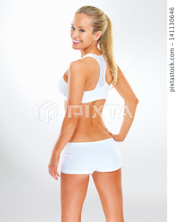 Woman, portrait and gym clothes in studio for fitness confidence or healthy training, wellness or white background. Female person, face and exercise workout or mockup space as health, care or athlete 141130646