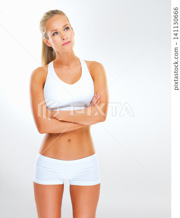 Vision, exercise and woman thinking of fitness, training and health with mockup isolated on white background. Female person, athlete and wellness coach with gym clothes for workout, aerobics and body Vision, exercise and woman thinking of fitness, training and health with mockup isolated on white background. Female person, athlete and wellness coach with gym clothes for workout, aerobics and body 141130666
