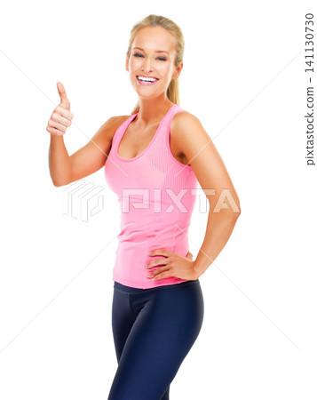 Woman, portrait and thumbs up for fitness in studio with yes gesture, exercise emoji and happy with workout. Athlete, person and smile with hand sign for success with training on white background 141130730