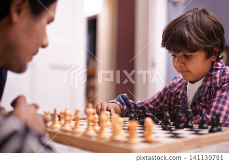 Child, father and chess strategy or planning checkmate move with knight, king or queen. Son, parent and thinking for competition learning or decision thoughts for playing, contest or problem solving Child, father and chess strategy or planning checkmate move with knight, king or queen. Son, parent and thinking for competition learning or decision thoughts for playing, contest or problem solving 141130791