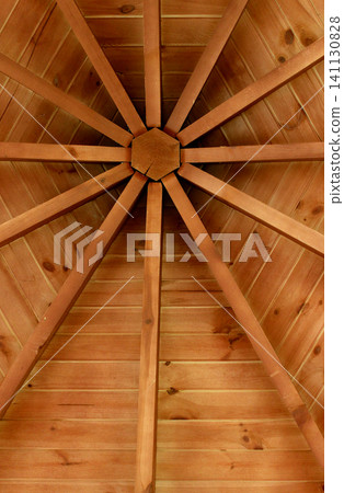 A web like pattern of wooden planks supporting a pyramidal roof vertical stock image A web like pattern of wooden planks supporting a pyramidal roof vertical stock image 141130828