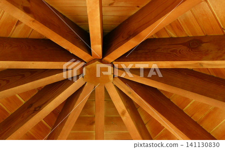 Beams of a conical roof of a wooden house detailed stock photo. Wooden cottage construction design Beams of a conical roof of a wooden house detailed stock photo. Wooden cottage construction design 141130830