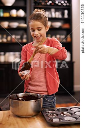 Girl, baking and learning with kid, smile and ingredients with utensils and child development with dessert. Home, apartment or kitchen with recipe and prepare with food or cupcake with joy or mixture Girl, baking and learning with kid, smile and ingredients with utensils and child development with dessert. Home, apartment or kitchen with recipe and prepare with food or cupcake with joy or mixture 141130866