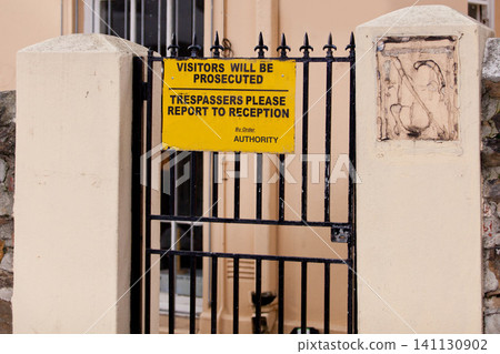 Sign, outdoor and warning with gate, building and authority with board and street with design. Notice, urban town and outside with road or safety with protection and review with information or poster Sign, outdoor and warning with gate, building and authority with board and street with design. Notice, urban town and outside with road or safety with protection and review with information or poster 141130902