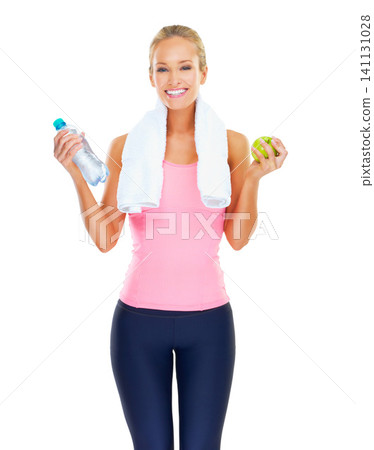 Girl, portrait and apple or water for wellness in studio with smile, healthy diet or nutrition for fitness goal. Athlete, person and happy with fruit to lose weight or body detox on white background Girl, portrait and apple or water for wellness in studio with smile, healthy diet or nutrition for fitness goal. Athlete, person and happy with fruit to lose weight or body detox on white background 141131028