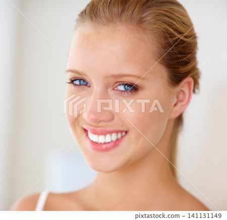Face, woman and home with skincare for smile in white background, happy and satisfied with routine results. Portrait, female person and treatment with glow for beauty, self care and confidence. Face, woman and home with skincare for smile in white background, happy and satisfied with routine results. Portrait, female person and treatment with glow for beauty, self care and confidence. 141131149