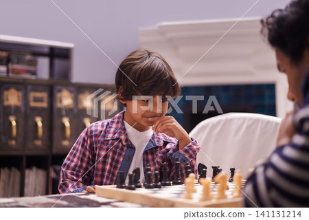 Child, father and chess game with strategy or checkmate move with knight, king or queen. Son, parent and thinking for competition learning or decision thoughts for playing, contest or problem solving Child, father and chess game with strategy or checkmate move with knight, king or queen. Son, parent and thinking for competition learning or decision thoughts for playing, contest or problem solving 141131214