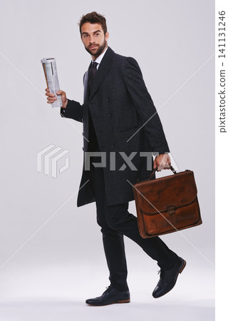 Businessman, briefcase and career walking in studio for employee commute, white background or mockup space. Male person, newspaper and journalist reporter for international news, article or new job Businessman, briefcase and career walking in studio for employee commute, white background or mockup space. Male person, newspaper and journalist reporter for international news, article or new job 141131246