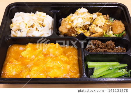 Delicious Chinese bento box with fried chicken and shrimp in chili sauce Delicious Chinese bento box with fried chicken and shrimp in chili sauce 141131278