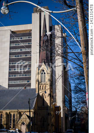 Historic Church Spire Rises Beside Modern Highrise Tower Toronto Canada Historic Church Spire Rises Beside Modern Highrise Tower Toronto Canada 141131478
