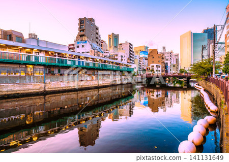 Yokohama cityscape, Japan: Noge, Yokohama. Harmonica Alley, a bar district. Yokohama Landmark Tower and Yokohama City Hall are visible in the background. 141131649