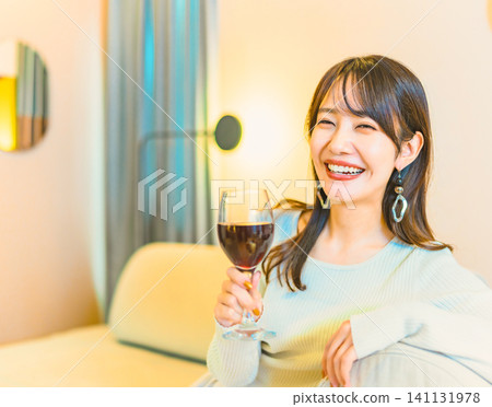 Woman drinking red wine Woman drinking red wine 141131978