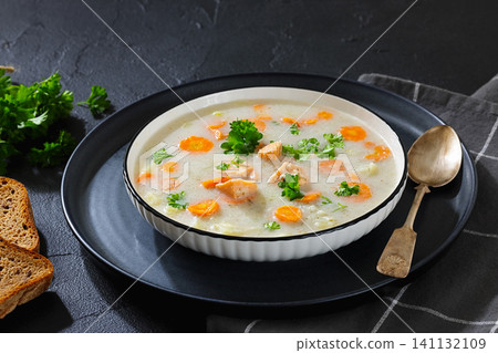 Soup with Chunky Potatoes and Carrots in a bowl Soup with Chunky Potatoes and Carrots in a bowl 141132109