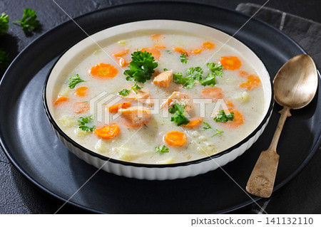 Soup with Chunky Potatoes and Carrots in a bowl Soup with Chunky Potatoes and Carrots in a bowl 141132110