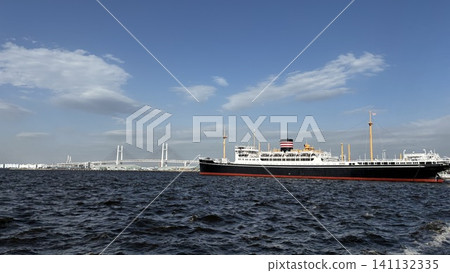 The NYK Hikawa Maru and Yokohama Bay Bridge in Yokohama Port The NYK Hikawa Maru and Yokohama Bay Bridge in Yokohama Port 141132335
