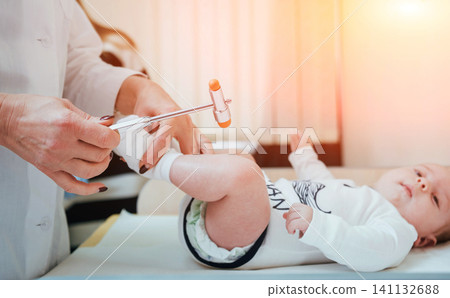 Neurologist diagnosing little boy. Pediatric Neurologist diagnosing little boy. Pediatric 141132688
