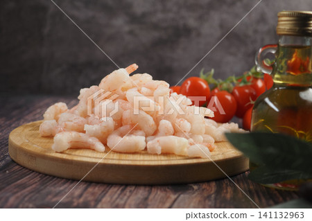 Fresh shrimp and cherry tomatoes ready for a delicious meal Fresh shrimp and cherry tomatoes ready for a delicious meal 141132963