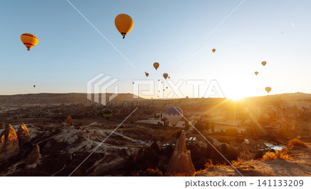 Open Air Museum. Flying hot air balloons rise in sunrise Cappadocia. Goreme National Park Turkey. Open Air Museum. Flying hot air balloons rise in sunrise Cappadocia. Goreme National Park Turkey. 141133209