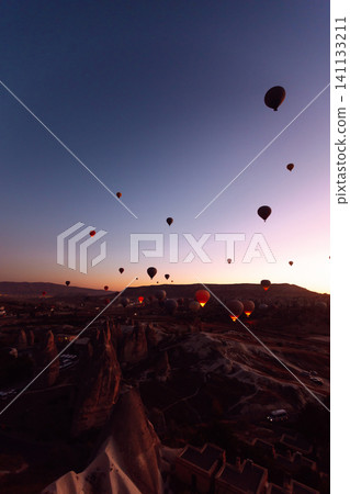 Open Air Museum. Flying hot air balloons rise in sunrise Cappadocia. Goreme National Park Turkey. Open Air Museum. Flying hot air balloons rise in sunrise Cappadocia. Goreme National Park Turkey. 141133211