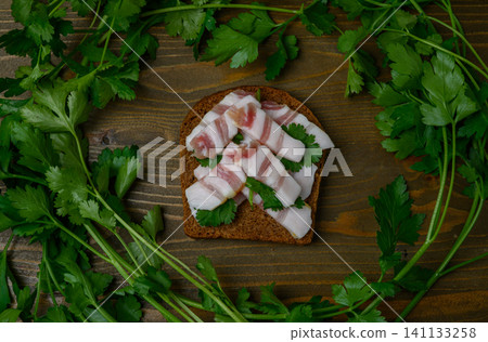 Lard "Christmas Tree" Sandwich on Wooden Table Decorated with Parsley Lard "Christmas Tree" Sandwich on Wooden Table Decorated with Parsley 141133258