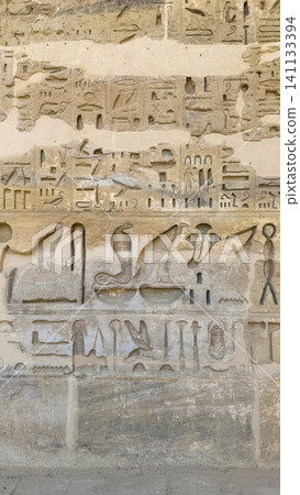 Beautiful bas-reliefs and ancient hieroglyphs from the mortuary temple of Ramesses III at Medinet Habu, Luxor, Egypt. Beautiful bas-reliefs and ancient hieroglyphs from the mortuary temple of Ramesses III at Medinet Habu, Luxor, Egypt. 141133394