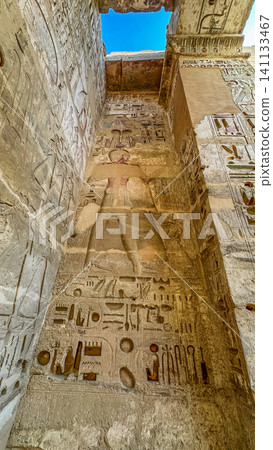 Beautiful bas-reliefs and ancient hieroglyphs from the mortuary temple of Ramesses III at Medinet Habu, Luxor, Egypt. Beautiful bas-reliefs and ancient hieroglyphs from the mortuary temple of Ramesses III at Medinet Habu, Luxor, Egypt. 141133467